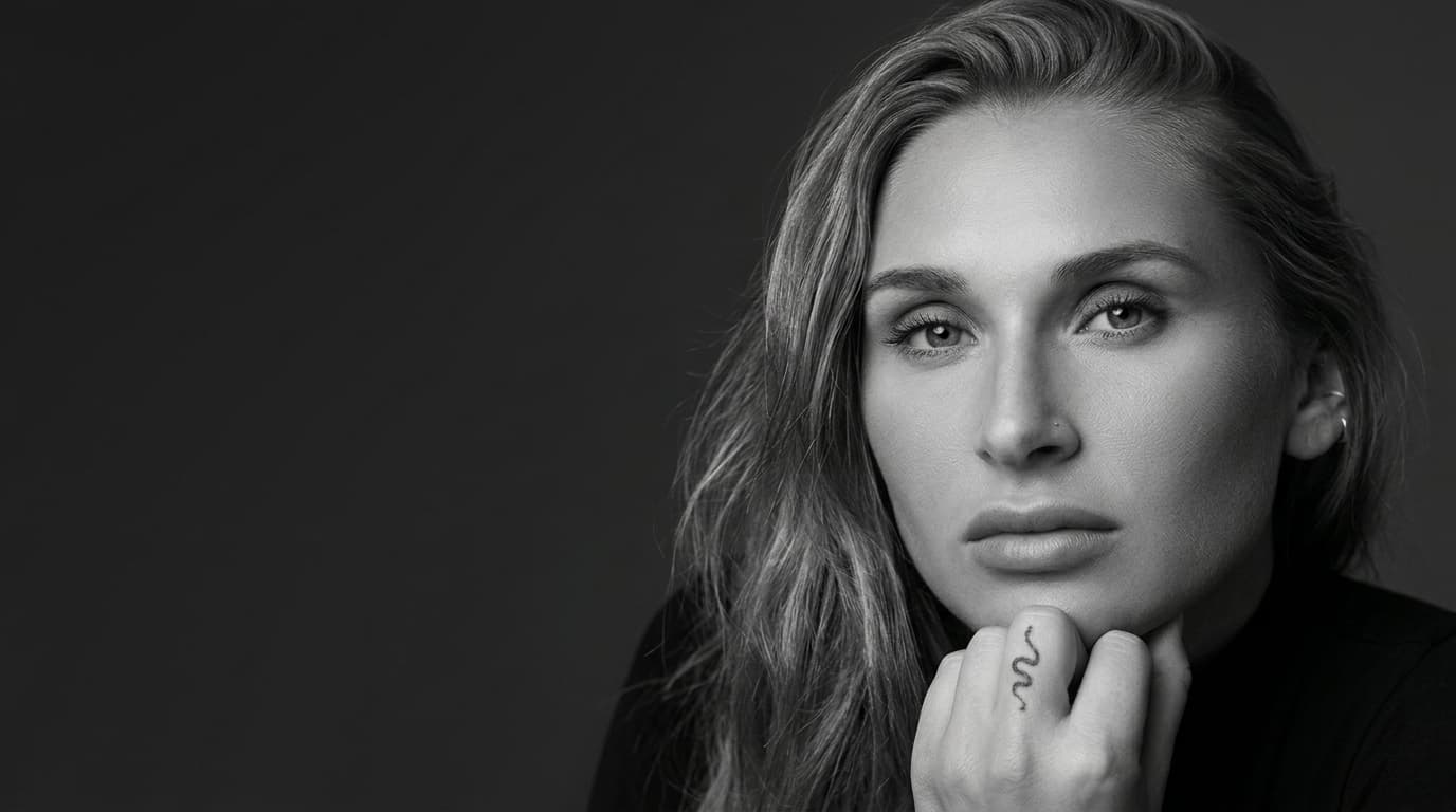 Black and white portrait of Summer Loffler with a direct, composed expression.